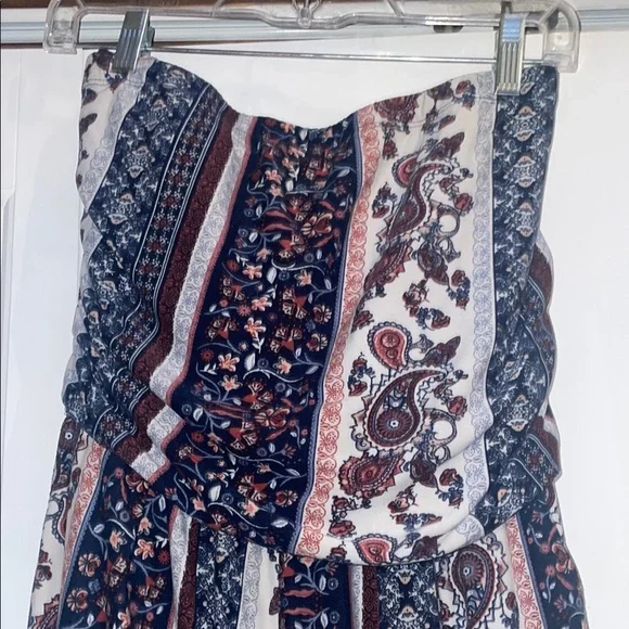 Elegant Blue and Cream Striped Jumpsuit with High Neckline - Picture 2 of 5